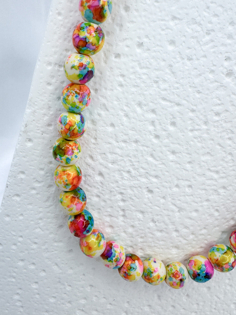 Neon splatter beads and steel necklace