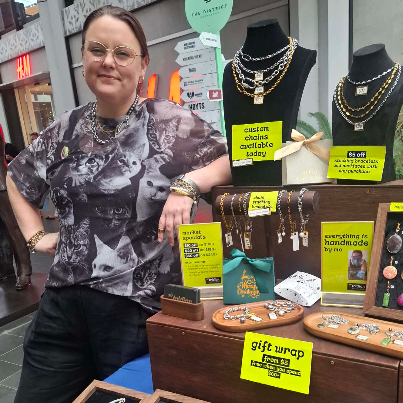 Megan Girdler standing in front of the iridian.design market stall