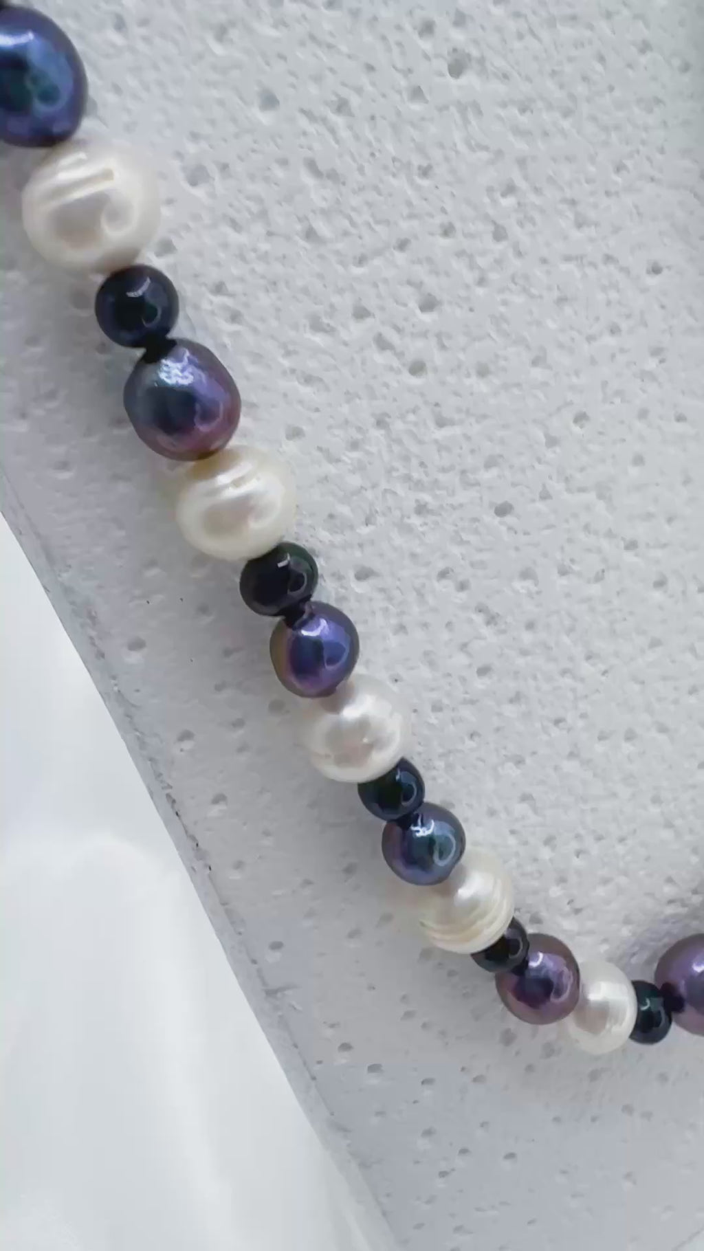 White, purple and black pearl necklace